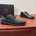 Prada Burnished Brogue Derby Shoes — front